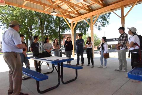 2023 Interns meeting with community members in Fulton Kentucky under a shelter house