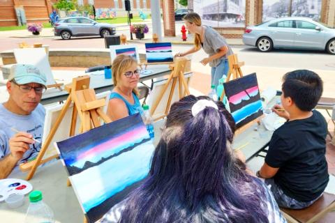 People paint at Art on the Plaza painting class at Appalachian Center for the Arts in downtown Pikeville