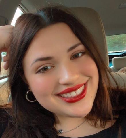 Keaton Sant's head pictured smiling, in her vehicle