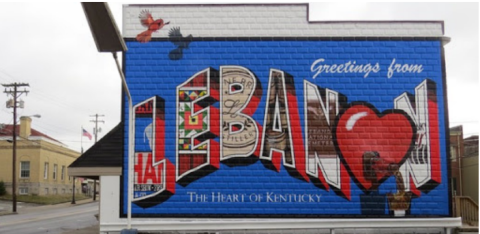 “LEBANON POSTCARD MURAL” Artist: Michael Cooper and “Murals and More” Team Location: Lebanon, Ky About the Mural: Intertwined into the large “Lebanon” are Marion County’s attractions and unique features.